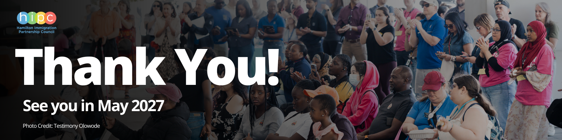 Website banner for Newcomer Day 2026 featuring group photo with white text overlay that reads: Thank You! See you in May 2027. Photo Credit: Testimony Olowode.